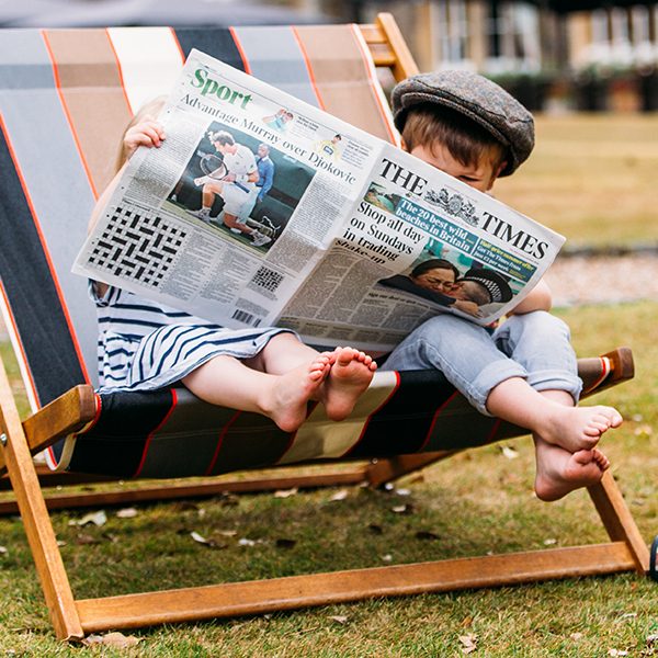 Kid Reading Newspaper