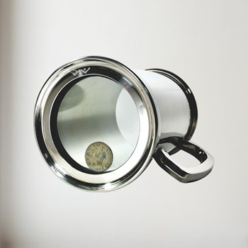 Shilling tankard showing trapped coin