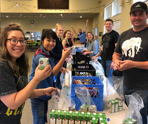 F5 employees pack lunches for kids to increase food security