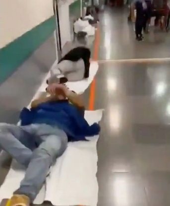 Heart-rending sight of coughing coronavirus patients laying on the hospital floor (video)