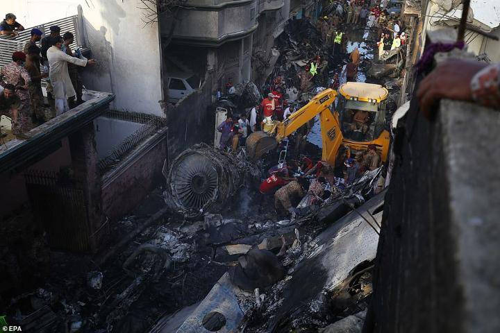 Pakistan plane plunges into Karachi residential structures, kills 97