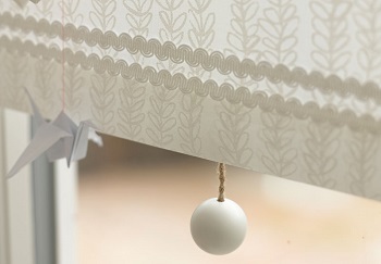 arco braid and wooden pull on white blind