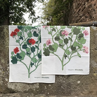 modern geranium kitchen tea towels in red