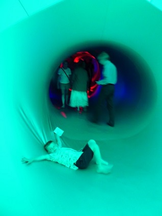 child having fun in luminarium child having fun in luminarium