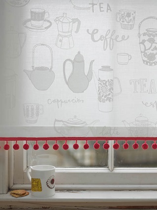 berry red pompom fringe on a white window blind