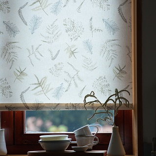 roller blind fabric in window with print