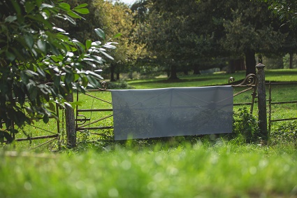 screen fabric displayed on an antique gate