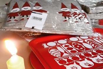 unpacking christmas stock by candlelight