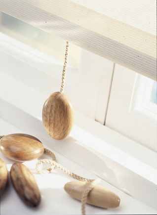 wooden pebble blind pull on a blind