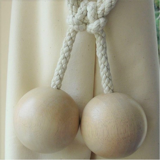 large wood ball curtain tieback in whitewashed beech and cotton rope embrace