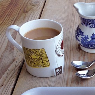 family favourites china mug with a selection of nice, bonbon, tunocks, wafer, digestive biscuits