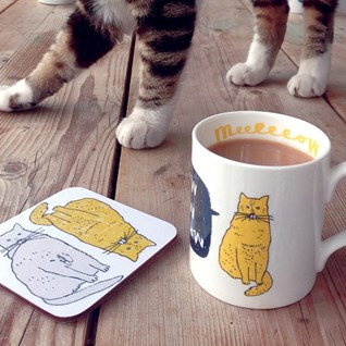 meow china mug by charlotte farmer with oscar the cat standing in background