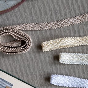 white regency braid is a traditional decorative patterned trimming