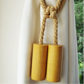 wooden cylinder curtain tieback in wax with cotton embrace