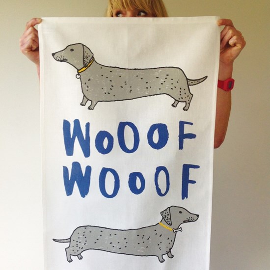 wooof kitchen tea towel of dachshund or sausage-dogs by illustrator charlotte farmer