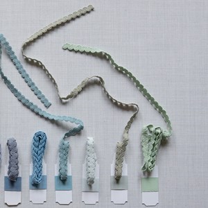 arco in porcelain blue colour is a wavy curvy decorative trimming or braid arco braid - porcelain blue