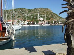Bozburun - View from the western pier to the village. Water depth in the harbour is about 5 m with good holding ground (sand).