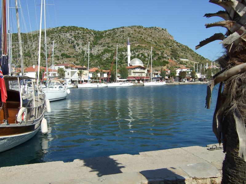 Bozburun - View from the western pier to the village. Water depth in the harbour is about 5 m with good holding ground (sand).